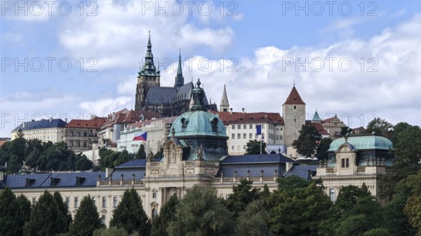 Historic buildings and towers under blue sky in an urban landscape, view of Hradcany, Prague Czech Republic