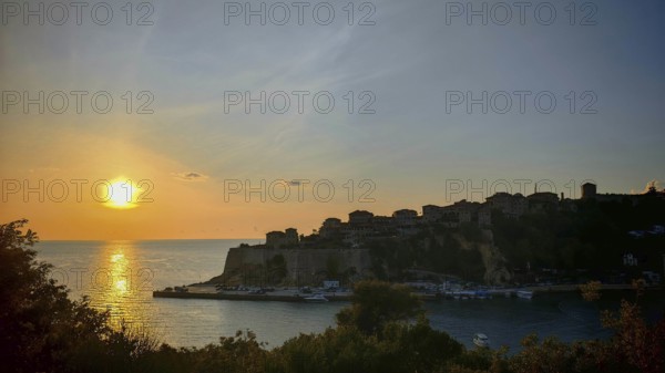Golden sunset over coastal town and seascape, Ulcinj, Montenegro