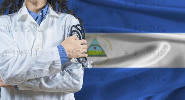 Healthcare professional with Nicaragua flag background. Professional doctor holding stethoscope on Nicaragua flag background