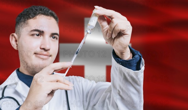 Doctor holding syringe on Switzerland flag background. Medical professional holding syringe with Swiss flag in the background