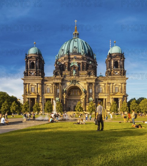 Berlin, Germany, Europe. The Berliner Dom with people enjoying the Summer sun