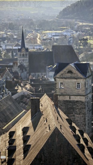 View of a wintry town with distinctive roofs and church tower, view of Kronach, Frankenwald nature park Park