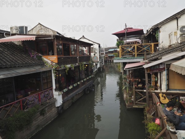 Rustic canal view with cozy decorated cafes and a sense of serenity, Zhujiajiao Ancient Town, Shanghai, China