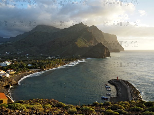 Coastal region with port and lighthouse, surrounded by mountains and sea, Puerto de la Aldea, Gran Canaria, Canary Islands, Spain