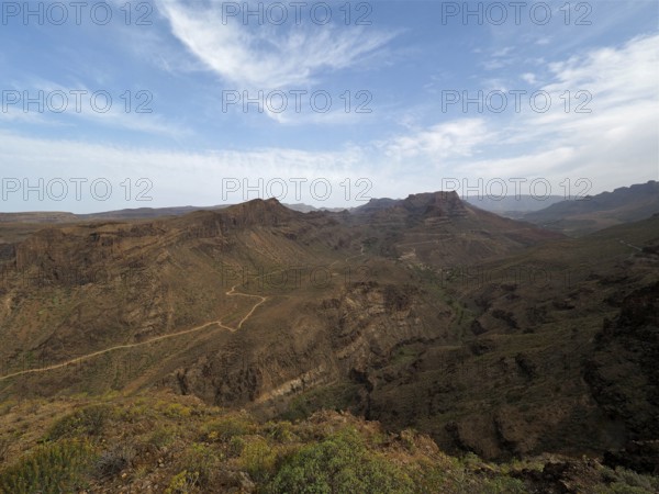 Wide view of a dry, rocky mountain landscape under clear sky, Degollada de las Yeguas, Gran Canaria, Canary Islands, Canary Islands, Spain