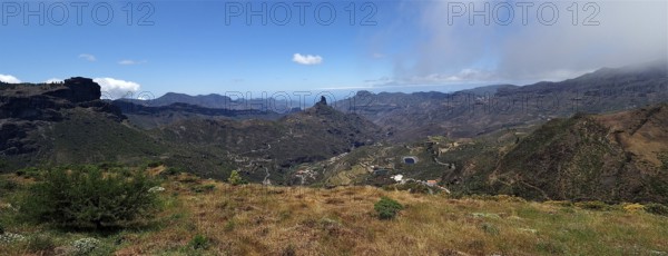 Wide mountain landscape with valley and cloudy sky in the distance. View from Cruz de Tejeda, Gran Canaria, Canary Islands, Canary Islands, Spain