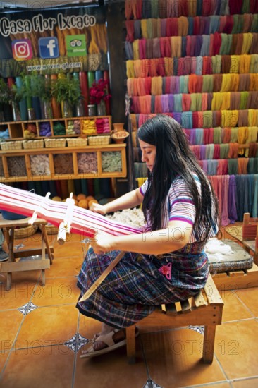 Maya woman, 42 years old, weaving with a back strap, traditional craft in a woman's cooperative, San Juan la Laguna, Atitlán, Sololá Department, Guatemala