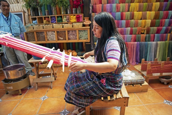 Maya woman, 42 years old, weaving with a back strap, traditional craft in a woman's cooperative, San Juan la Laguna, Atitlán, Sololá Department, Guatemala