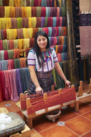 Maya woman, 42 years old, working on a weaving frame, traditional crafts in a woman's cooperative, San Juan la Laguna, Atitlán, Sololá Department, Guatemala