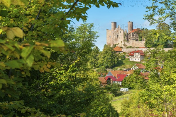 View of the ruins of Hanstein Castle and the small village of Rimbach with half-timbered houses, Bornhagen, Eichsfeld, Thuringia, Germany