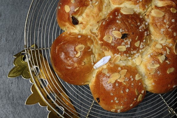 Epiphany cake with paper crown and king, Switzerland
