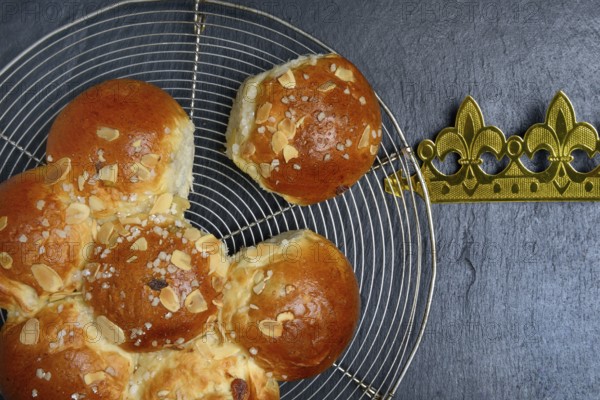 Epiphany cake with crown on wire rack, Switzerland