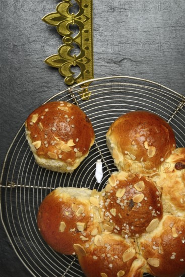 Epiphany cake with paper crown and king, Switzerland