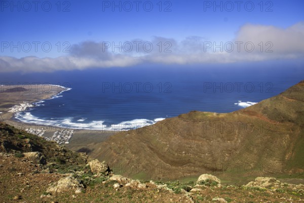 Panoramic view of the coast from Mirador de Ermita de Las Nieves with moving sea and slightly cloudy sky, Mirador de Ermita de Las Nieves, Lanzarote