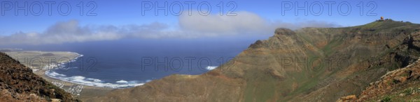 Extensive panorama with mountains and sea in the background under blue sky, Mirador de Ermita de Las Nieves, Lanzarote