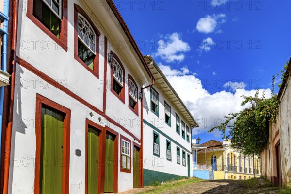 A slope lined with old colonial style mansions in the historic city of Ouro Preto, Ouro Preto, Minas Gerais, Brazil