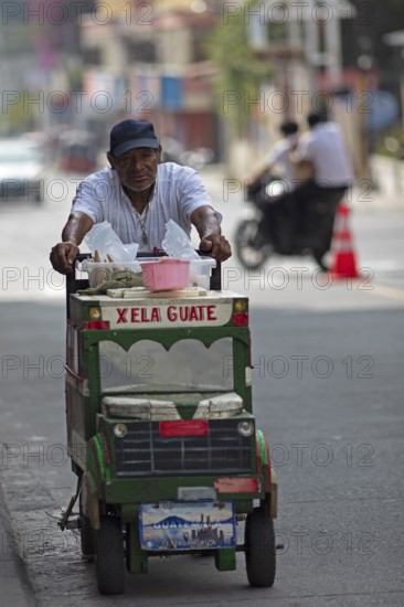 Guatemalan ice cream vendor on a street in Panajachel, Atitlán, Sololá Department, Guatemala