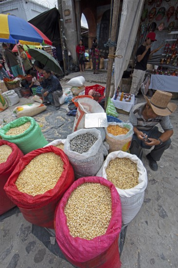 Different colored corn in bags for sale at the market in Chichicastenango, Highlands, El Quiché Department, Guatemala