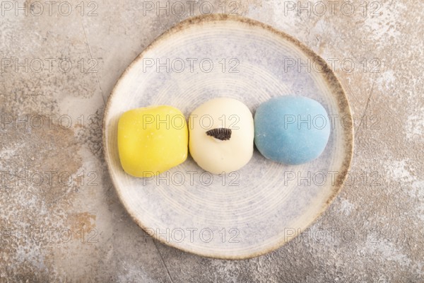 Japanese Mochi Cakes on brown concrete background, top view, flat lay, close up