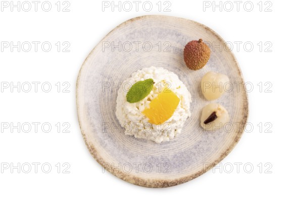 White ?ottage cheese, Curd, with orange and lychee isolated on white background, top view, flat lay, close up