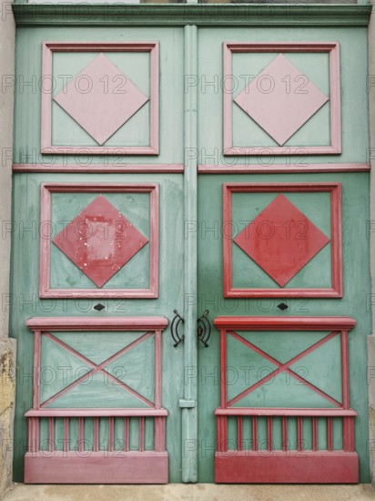 Colored door with geometric patterns in pink and green, Czech Republic