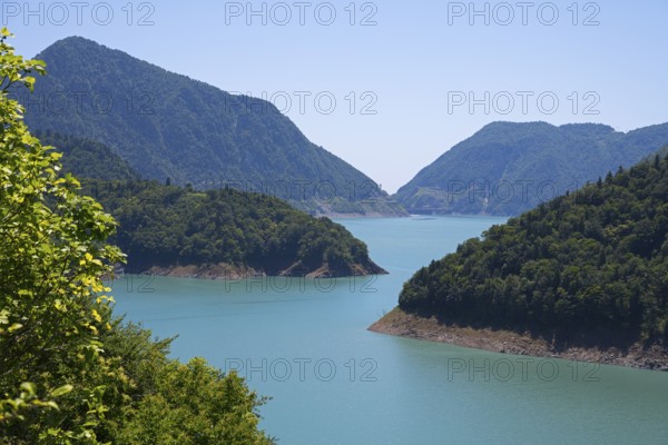 Large, calm lake surrounded by forested mountains, Jvari Reservoir, Enguri River, Mingrelia region and Upper Svaneti, Georgia