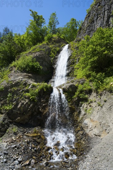 Small waterfall falling over green rocks, waterfall near Dizi, road 7, Mingrelia and Upper Svaneti region, High Caucasus, Georgia