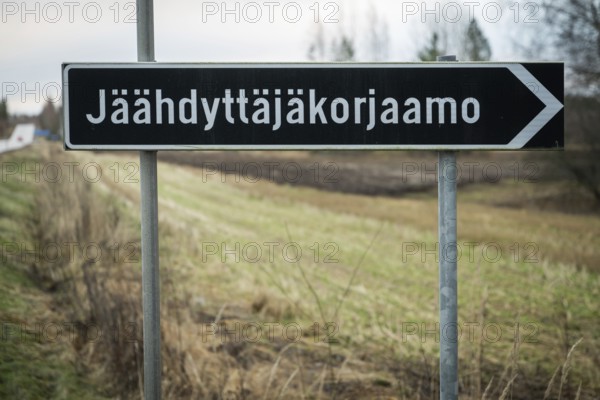 Long Finnish place name Jäähdyttäjäkorjaamo with 19 letters on a road sign, near Heinola, Finland
