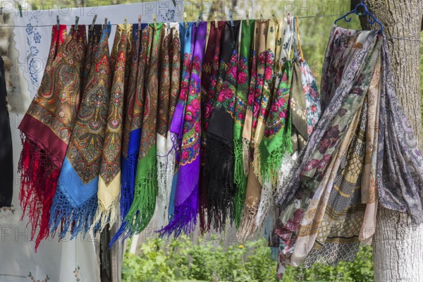 Colourful headscarves on a leash, souvenirs at Voronet Monastery, Buckovina, Romania