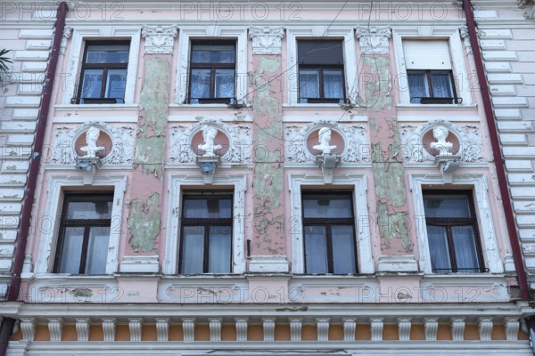 Dilapidated house façade with busts from Greek mythology, Czernowicz, Ukraine
