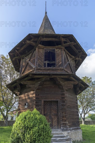 Wooden bell tower near the Church of the Exaltation of the Cross, Patrauti Moldavian monastery from the 15th century, Patrauti, Romania