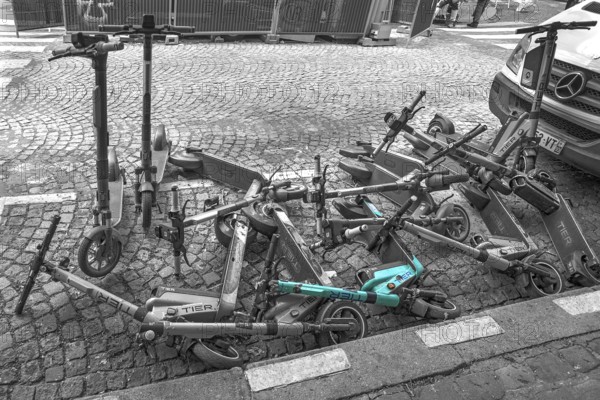 E-scooters thrown into the heap on the street after the e-scooter ban, black white, Paris, France