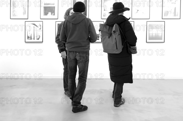 Visitors in an exhibition, black and white, Bavaria, Germany