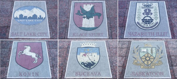 Six floor plates, coats of arms of various European countries on the central square in Czernowicz, Ukraine