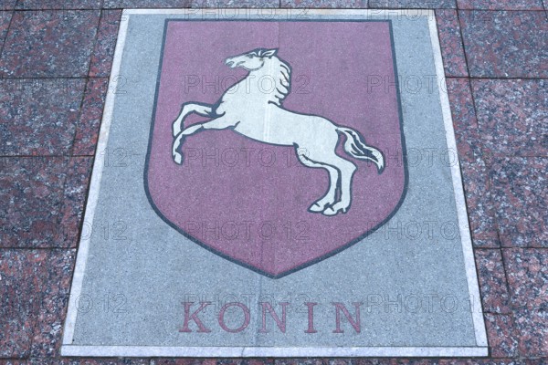 Base plate, coat of arms of Konin, Poland, on the central square in Czernowicz, Ukraine