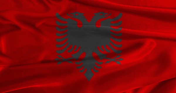 Flag of Albania with fabric textured background. Close up of National flag of Albania with realistic texture