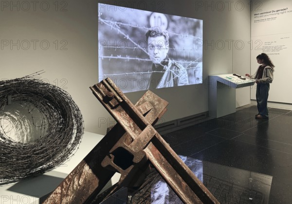 Construction of the Wall as a presentation in the House of History with original material and contemporary film with a young visitor, Bonn, North Rhine-Westphalia, Germany