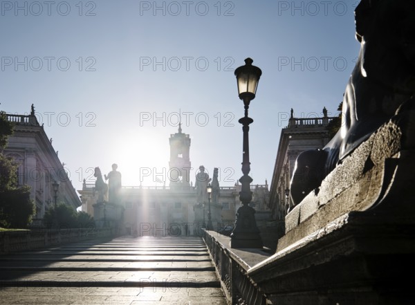 Staircase leading to the Capitoline Square, Statues of the Dioscuri Castor and Pollux, Piazza di Campidoglio backlit on the Capitoline Hill, Palazzo Senatorio, Palazzo dei Conservatori, Rome, Lazio, Italy
