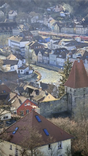 View of a city with a river, brick houses and a passing train, Kronach, Upper Franconia