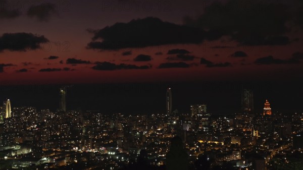 City view at night with illuminated buildings and dark sky, Batumi, Georgia