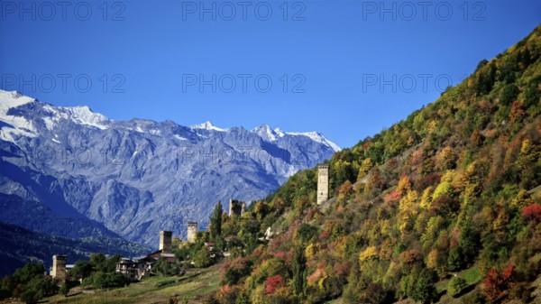 Mountain landscape with thick forests and medieval towers in autumn, Mestia, Georgia