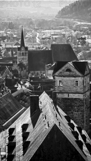Black and white photo of a town with church tower and historic buildings, view over the roofs of Kronach, Upper Franconia
