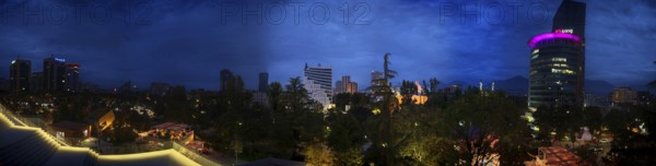 Panoramic view of an illuminated skyline at night with skyscrapers and lights, Tirana, Albania