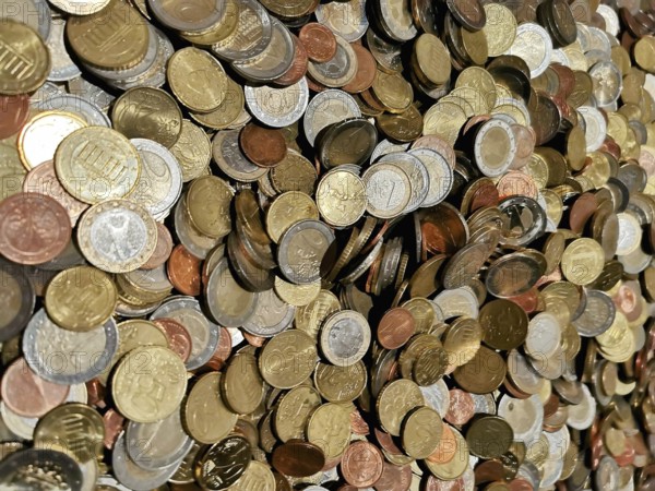 Different coins in a colorful collection in a heap