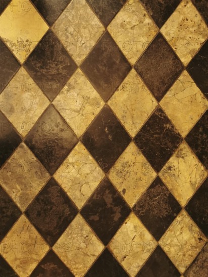 Checkerboard pattern of brown and yellow marble tiles