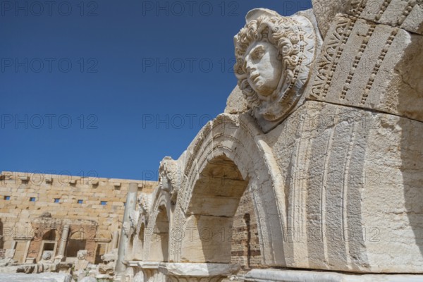 Leptis Magna, Libya, North Africa. The Medusa head on archaeological remains from the majestic Roman City of Leptis Magna. The city was originally built by the Phoenicians