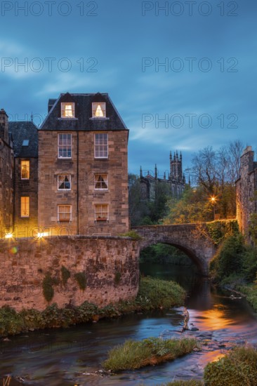 Dean Village, Edinburgh, Scotland, UK. Traditional houses and church with canal in historic Dean Village