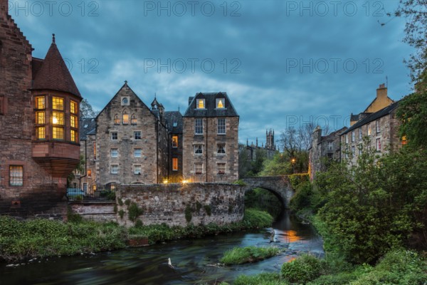 Dean Village, Edinburgh, Scotland, UK. Traditional houses and church with canal in historic Dean Village