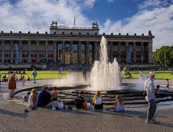 Water fountain, summer lifestyle, tourists and passers-by in the pleasure garden in Berlin-Mitte, Berlin, Germany