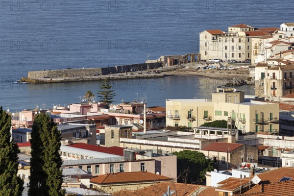 View of Cefalù in winter, view over the rooftops of the harbor and the Tyrrhenian Sea, medieval old town, Cefalu, Sicily, Italy